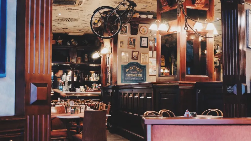 The warmly lit interior of a restaurant