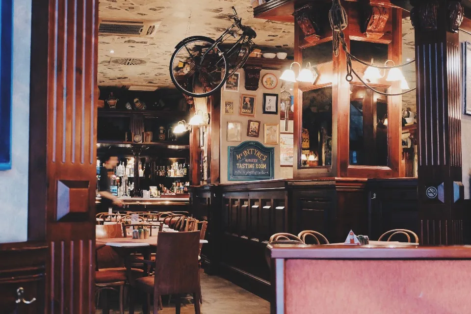 The warmly lit interior of a restaurant