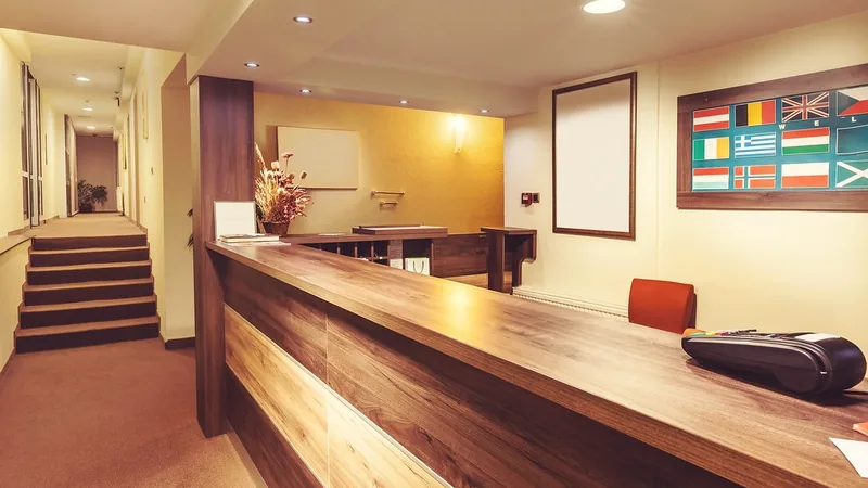 An empty reception desk in a hotel lobby